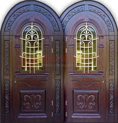 Индивидуальная арочная дверь со стеклом и ковкой ДА-19 в Истре